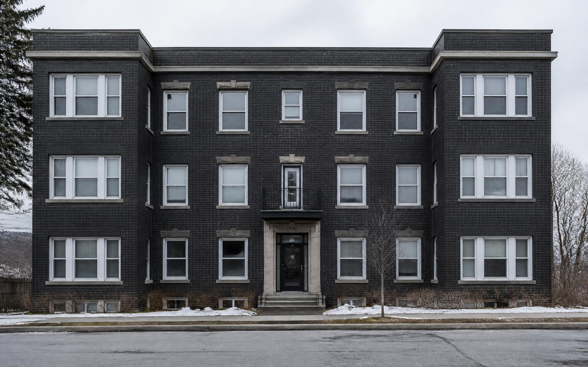 Multifamily brick apartment building exterior in Upstate New York